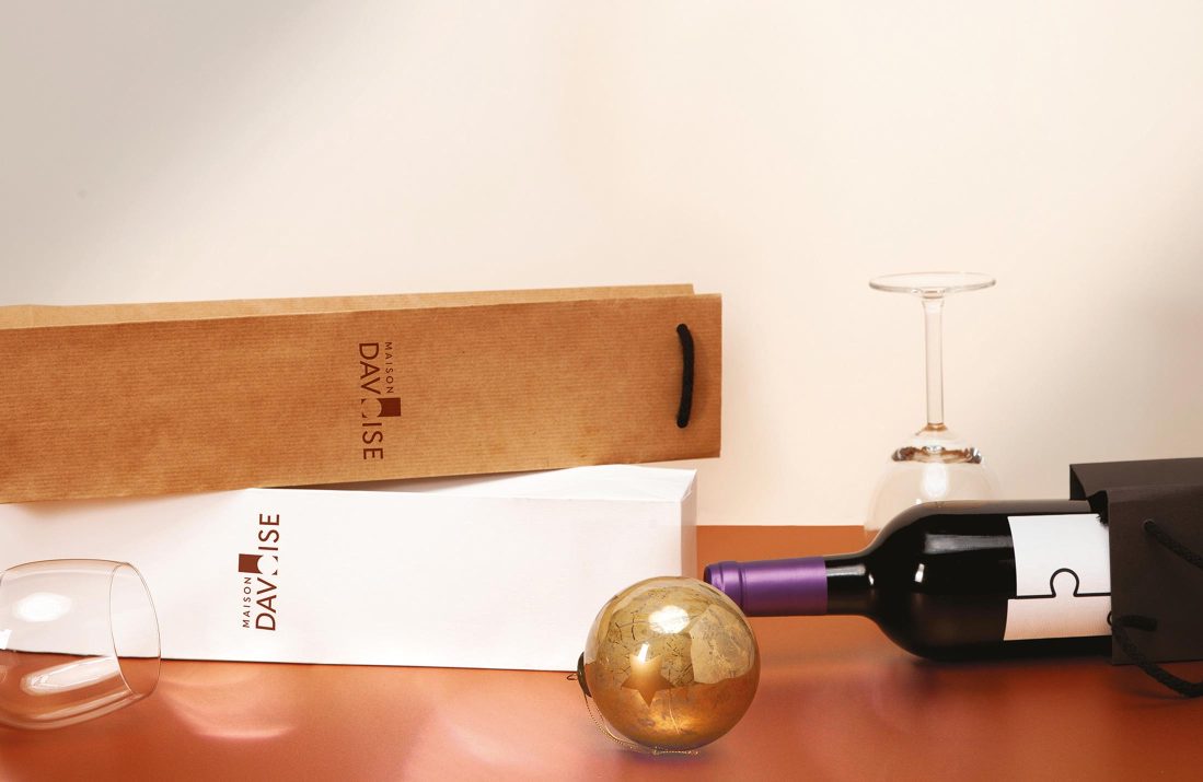 cardboard packaging for wine with bottle of red wine and glass