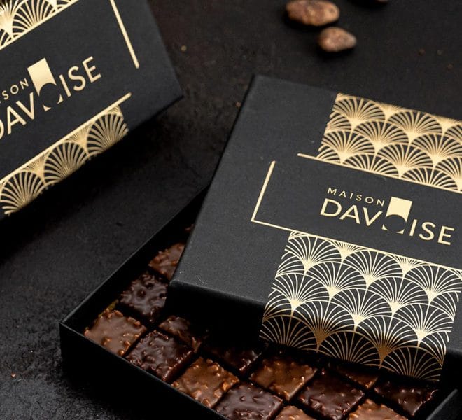 Black and gold boxes with chocolate inside