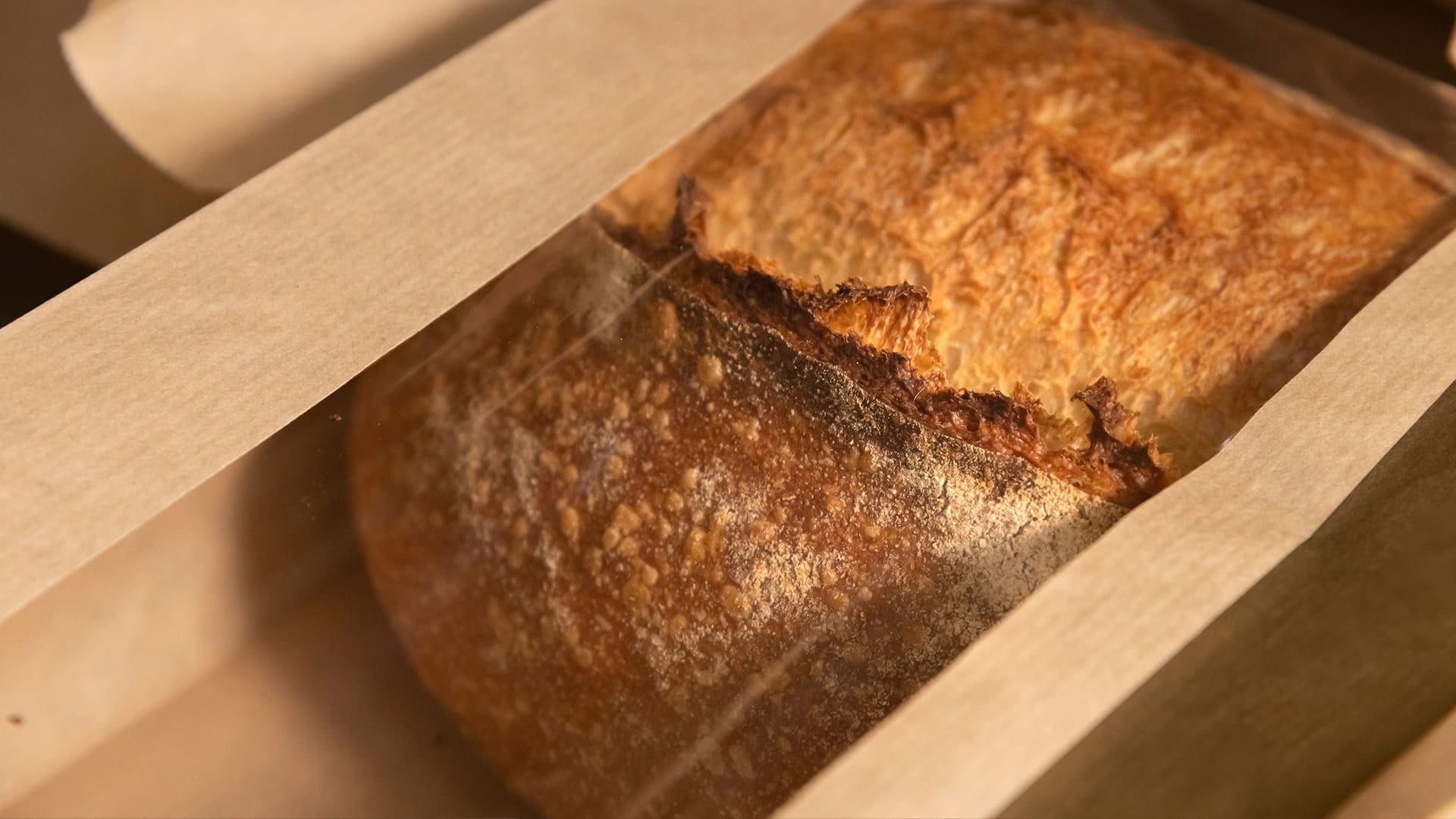 Bread in brown and transparent paper packaging