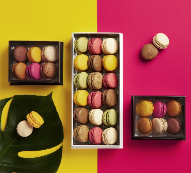Yellow and pink background, with macaron boxes fulfilled